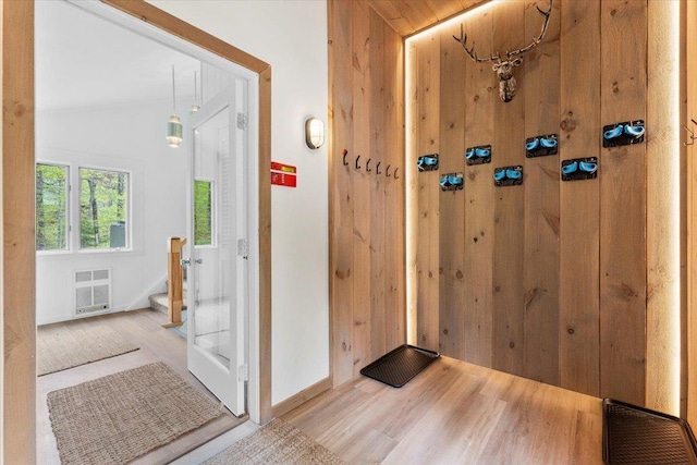 6 Roundtree Rd, Winhall, VT 05340 - foyer with wood finished floors, stairway, and baseboards