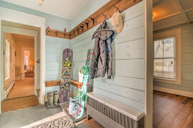56 Andover St, Ludlow, VT 05149 - mudroom with radiator, a baseboard heating unit, wood finished floors, and wood walls