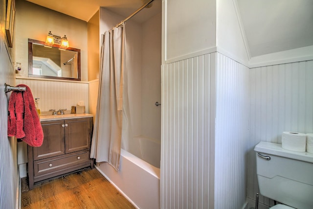 56 Andover St, Ludlow, VT 05149 - full bathroom featuring wood finished floors, wainscoting, toilet, shower / bath combo, and vanity