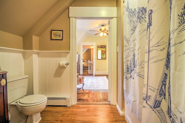 56 Andover St, Ludlow, VT 05149 - bathroom with a baseboard radiator, wood finished floors, toilet, ceiling fan, and lofted ceiling