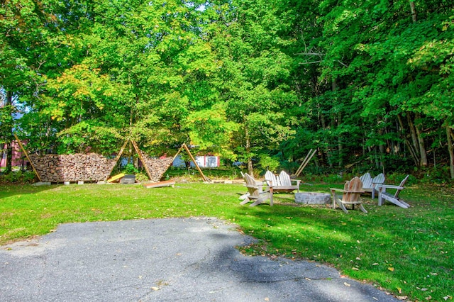 56 Andover St, Ludlow, VT 05149 - view of grassy yard featuring a fire pit