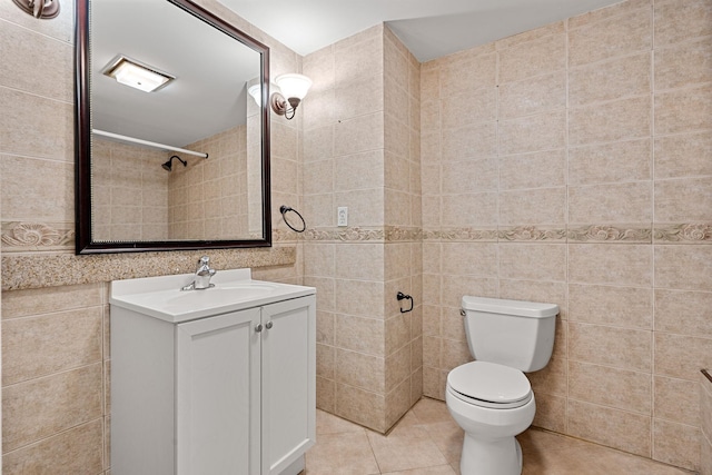 7 Pond Rd, Derry, NH 03038 - bathroom with tile walls, vanity, toilet, and tile patterned flooring
