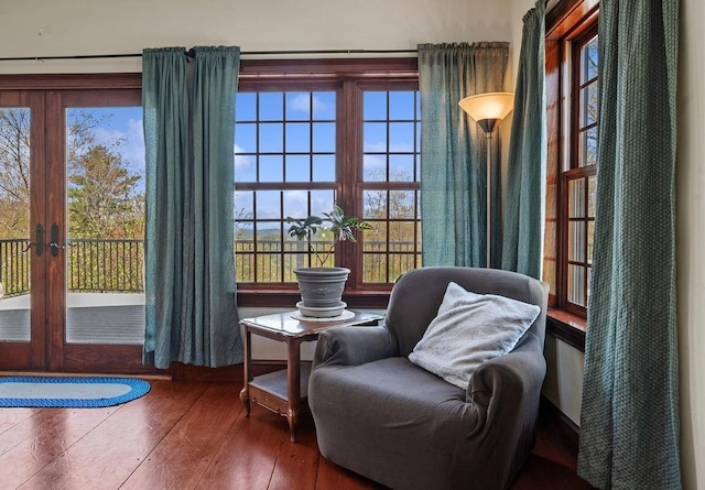 sitting room with wood-type flooring and french doors