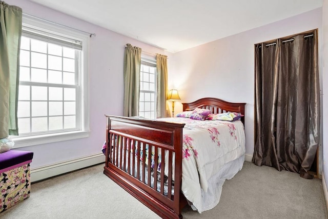 bedroom featuring a baseboard radiator, carpet flooring, and baseboards