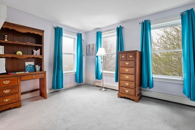 bedroom featuring carpet floors, multiple windows, baseboards, and baseboard heating