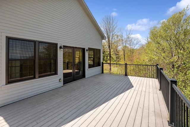 wooden deck featuring french doors