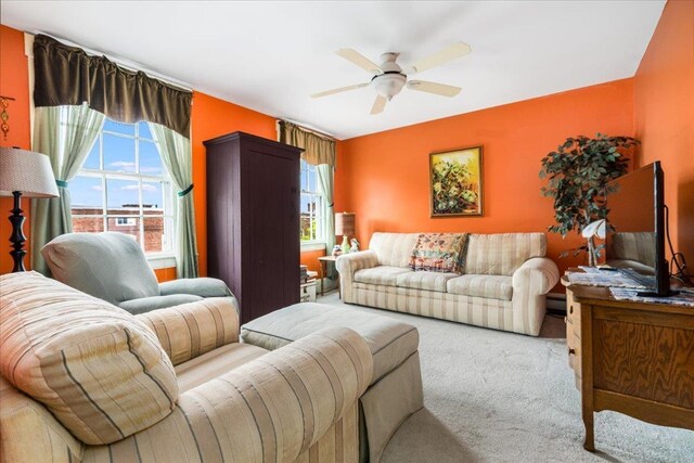 67 Kidder St, Manchester, NH 03101 - living area with healthy amount of natural light, carpet, and a ceiling fan