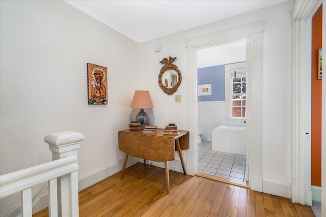 67 Kidder St, Manchester, NH 03101 - corridor featuring wood-type flooring and baseboards