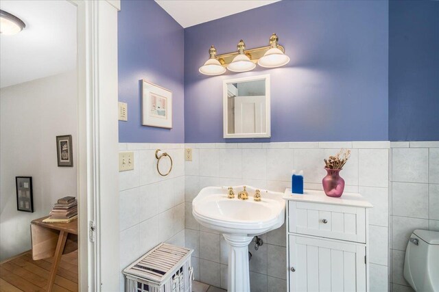 67 Kidder St, Manchester, NH 03101 - bathroom featuring tile walls and toilet
