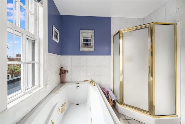 67 Kidder St, Manchester, NH 03101 - bathroom featuring tile walls, a stall shower, and a jetted tub