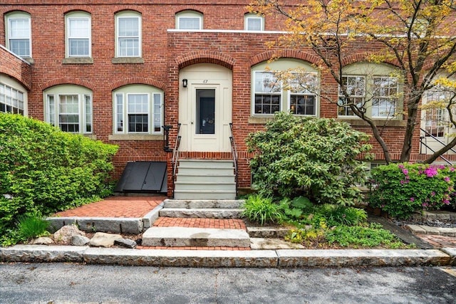 67 Kidder St, Manchester, NH 03101 - view of property featuring brick siding and entry steps