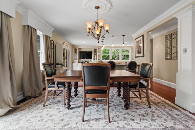 25 Golden Gate Dr, Hooksett, NH 03106 - dining room featuring a chandelier, wood finished floors, and baseboards