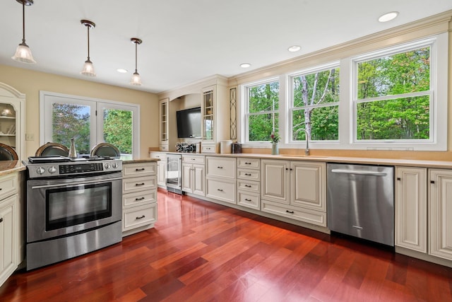 25 Golden Gate Dr, Hooksett, NH 03106 - kitchen with appliances with stainless steel finishes, beverage cooler, light countertops, a sink, and hanging light fixtures