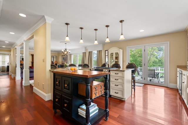 25 Golden Gate Dr, Hooksett, NH 03106 - kitchen with wood counters, decorative columns, plenty of natural light, crown molding, and recessed lighting