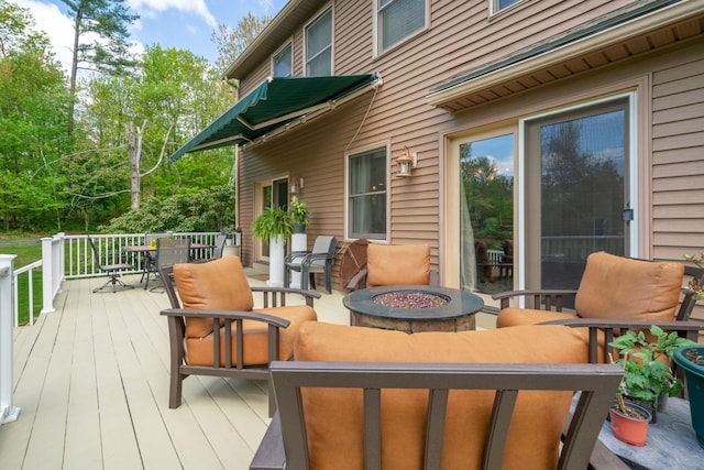 25 Golden Gate Dr, Hooksett, NH 03106 - wooden terrace featuring outdoor dining space and an outdoor fire pit