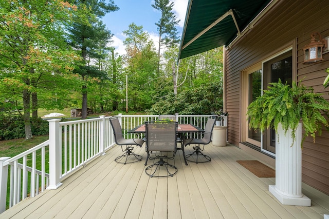 25 Golden Gate Dr, Hooksett, NH 03106 - deck with outdoor dining area and view of wooded area