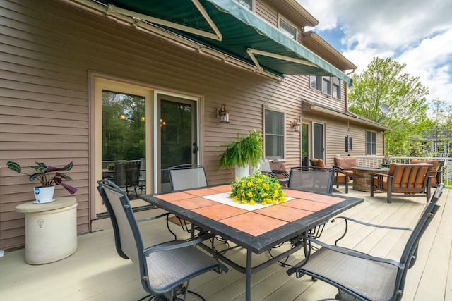 25 Golden Gate Dr, Hooksett, NH 03106 - wooden deck with outdoor dining space and an outdoor hangout area
