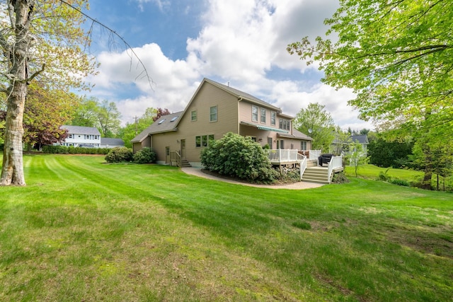 25 Golden Gate Dr, Hooksett, NH 03106 - rear view of property featuring a wooden deck and a lawn