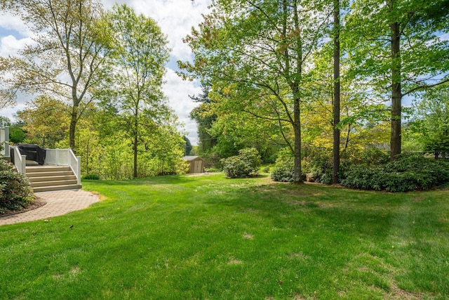 25 Golden Gate Dr, Hooksett, NH 03106 - view of green lawn featuring a wooden deck