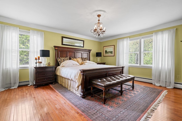 25 Golden Gate Dr, Hooksett, NH 03106 - bedroom with light wood-type flooring, a chandelier, and ornamental molding