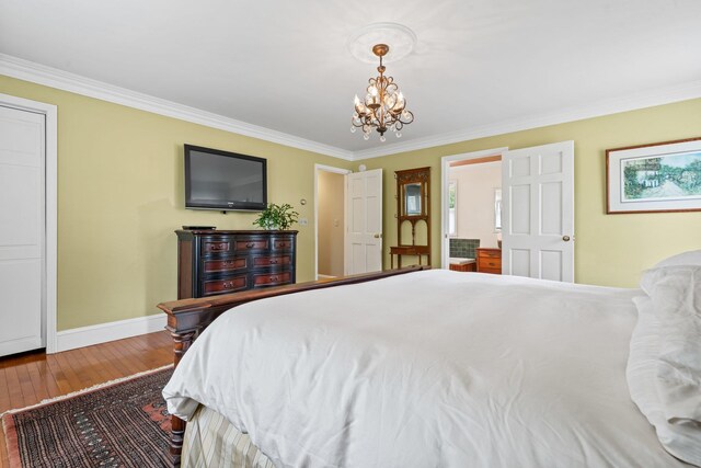 25 Golden Gate Dr, Hooksett, NH 03106 - bedroom with a chandelier, ornamental molding, baseboards, and hardwood / wood-style floors