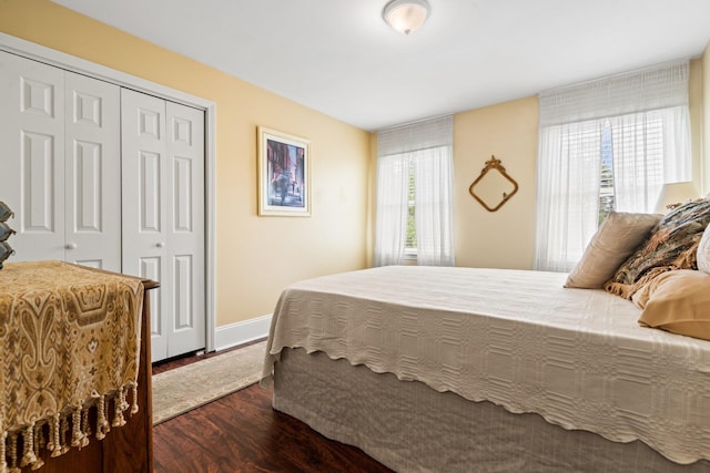 25 Golden Gate Dr, Hooksett, NH 03106 - bedroom featuring dark wood-style floors, a closet, and baseboards