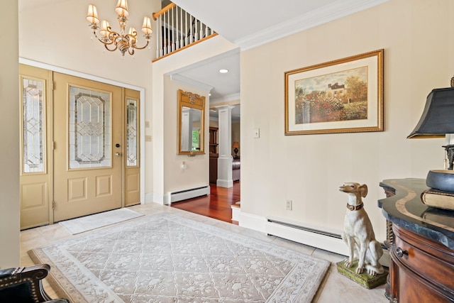 25 Golden Gate Dr, Hooksett, NH 03106 - foyer with a baseboard radiator, a chandelier, crown molding, tile patterned floors, and recessed lighting