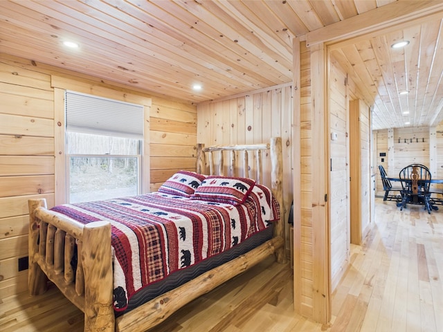 bedroom with wood walls, wood ceiling, wood-type flooring, and recessed lighting