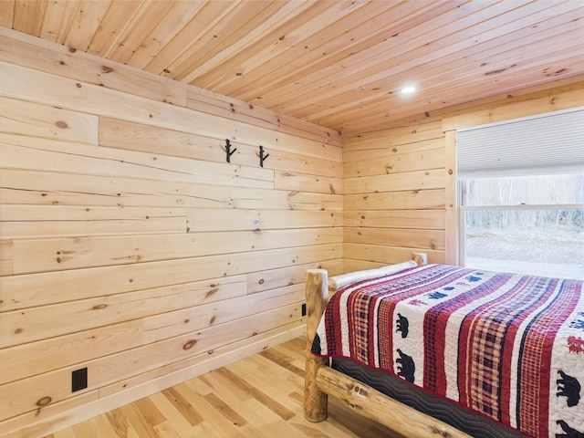 bedroom with wood ceiling, wood finished floors, wooden walls, and recessed lighting