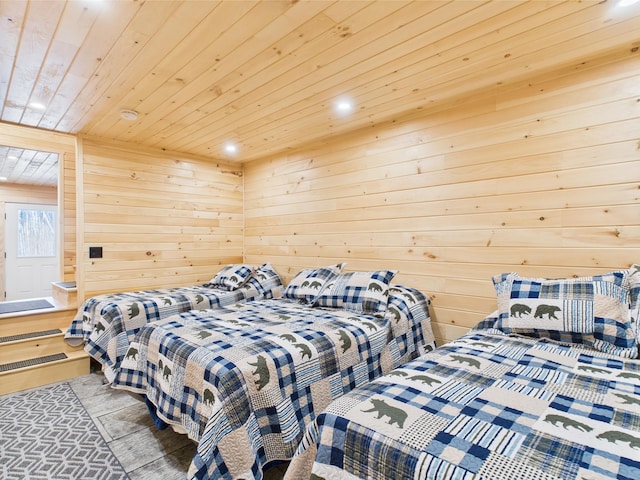 bedroom featuring wooden ceiling, recessed lighting, and wood walls