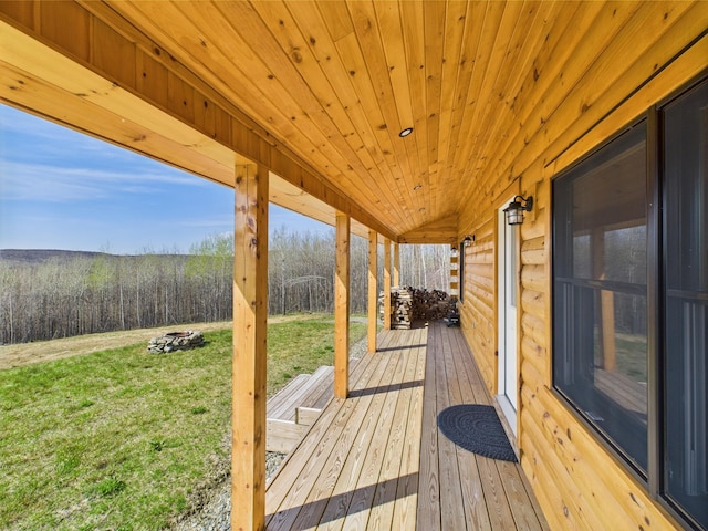 deck featuring a lawn