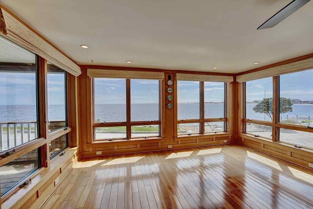 5 Great Boars Head Ave, Hampton, NH 03842 - unfurnished sunroom with a water view, hardwood / wood-style floors, and plenty of natural light