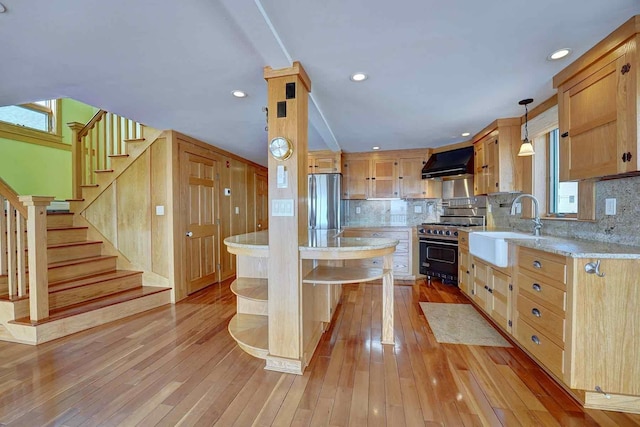 5 Great Boars Head Ave, Hampton, NH 03842 - kitchen featuring stainless steel appliances, a sink, exhaust hood, open shelves, and backsplash
