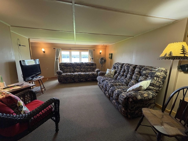 carpeted living room featuring ornamental molding and baseboards