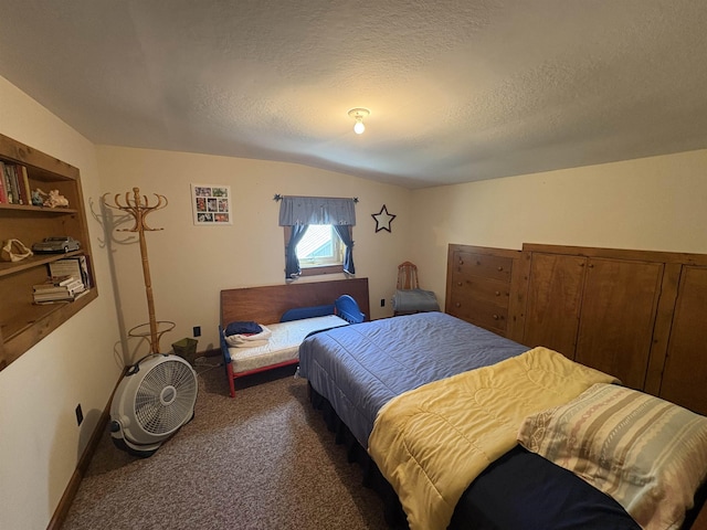 bedroom with carpet floors, lofted ceiling, and a textured ceiling