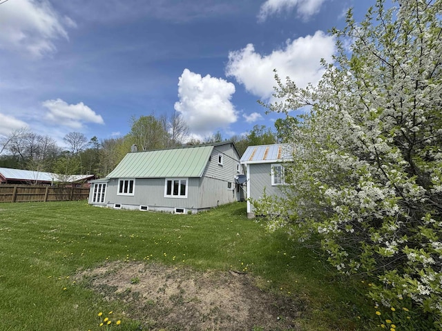 back of property featuring metal roof and a gambrel roof