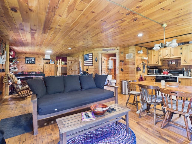 living room with light wood-type flooring, wooden walls, wooden ceiling, and recessed lighting