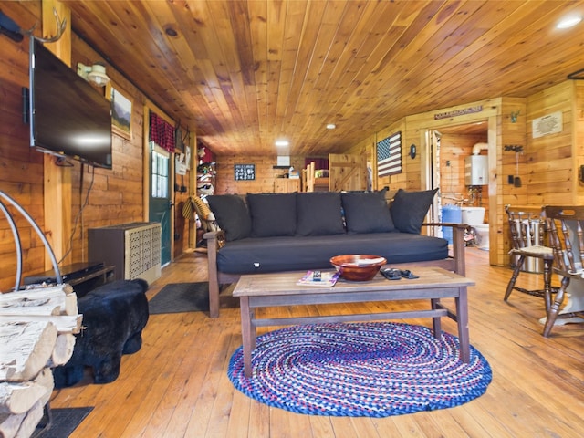 living room featuring wood walls, hardwood / wood-style flooring, and wood ceiling