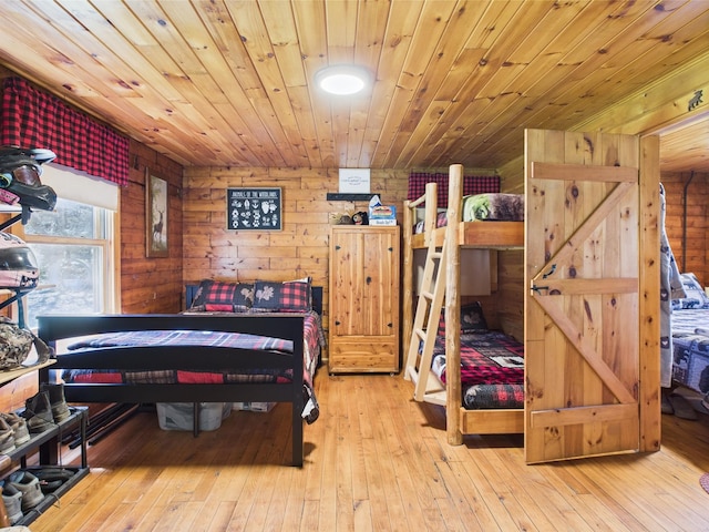 bedroom with hardwood / wood-style flooring and wooden ceiling