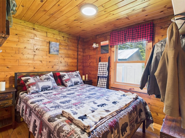 bedroom featuring hardwood / wood-style floors, wooden ceiling, and wood walls