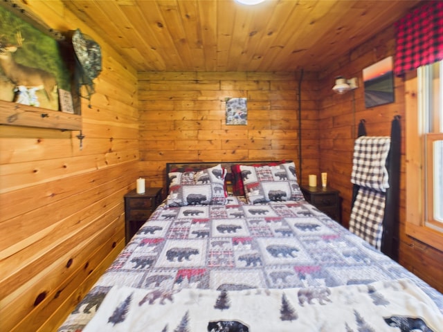 bedroom featuring wood ceiling and wooden walls