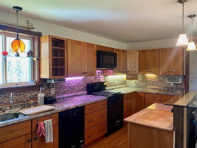 1810 Vt Route 102, Canaan, VT 05903 - kitchen with black appliances, tasteful backsplash, pendant lighting, and light wood-style floors
