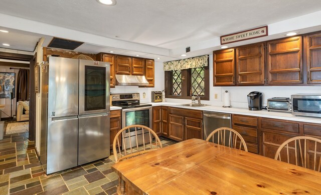 148 Lucerne Ave Unit 15, Laconia, NH 03246 - kitchen with stainless steel appliances, under cabinet range hood, a sink, recessed lighting, and open shelves