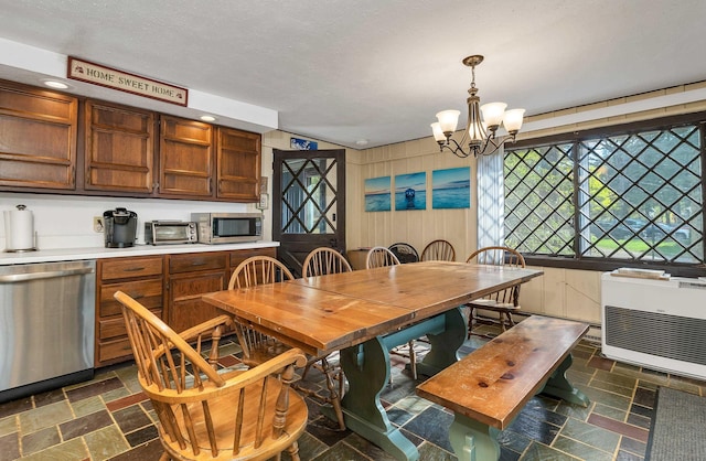 148 Lucerne Ave Unit 15, Laconia, NH 03246 - dining area with heating unit, stone tile floors, a chandelier, recessed lighting, and a textured ceiling