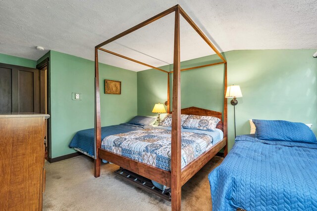 148 Lucerne Ave Unit 15, Laconia, NH 03246 - carpeted bedroom with a textured ceiling and baseboards