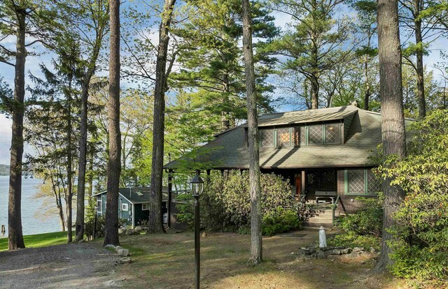 148 Lucerne Ave Unit 15, Laconia, NH 03246 - mid-century modern home featuring a chimney and a water view