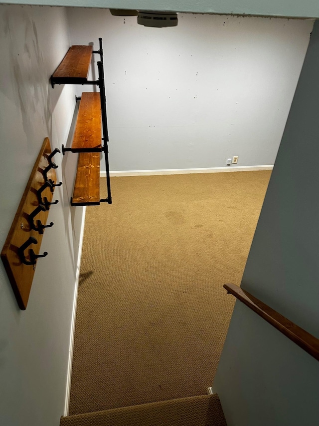 stairway with carpet and baseboards