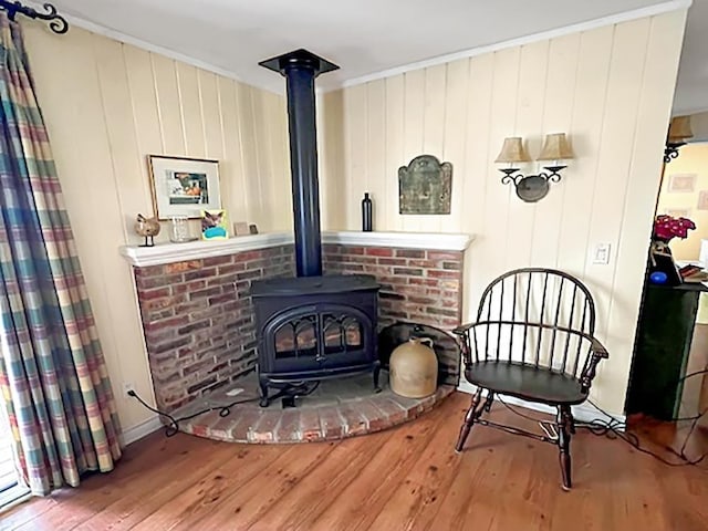 121 Platt Rd, Highgate, VT 05459 - living area with a wood stove, hardwood / wood-style floors, and wood walls