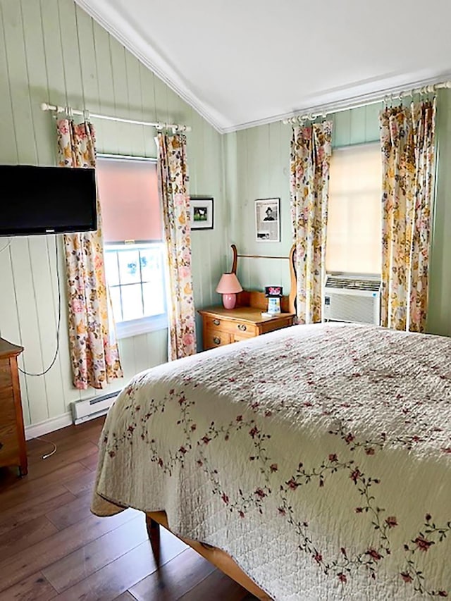 121 Platt Rd, Highgate, VT 05459 - bedroom with hardwood / wood-style flooring, crown molding, lofted ceiling, a baseboard heating unit, and baseboards