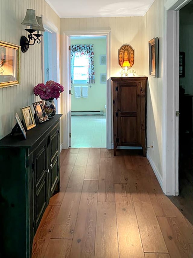 121 Platt Rd, Highgate, VT 05459 - hallway with a baseboard radiator, hardwood / wood-style flooring, and crown molding